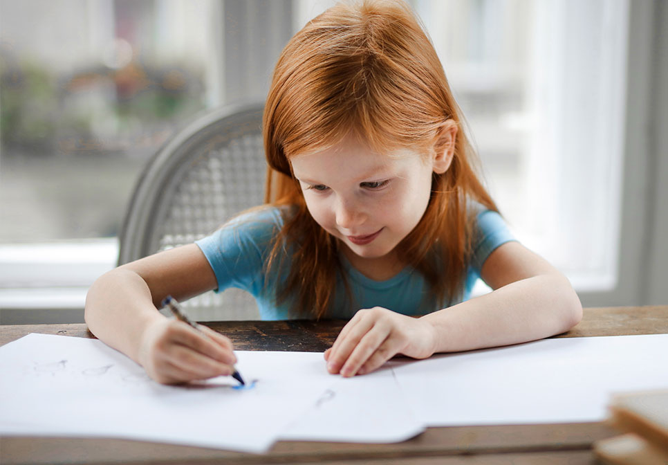 A child draws with markers during a counseling session